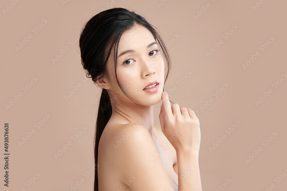 Beautiful young asian woman with clean fresh skin on beige background, Face care, Facial treatment, Cosmetology, beauty and spa, Asian women portrait. Beautiful young asian woman with clean fresh skin on beige background, Face care, Facial treatment, Cosmetology, beauty and spa, Asian women portrait.