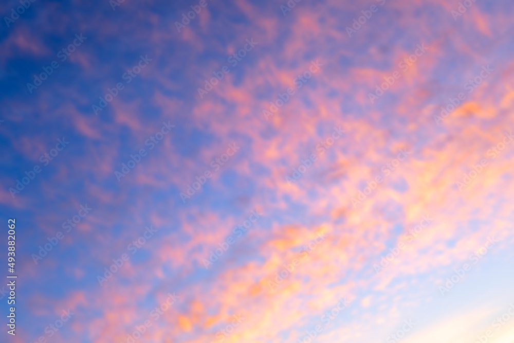 Bright, light, saturated, soft, abstract background. Sunset in blur. Summer time and mood. Beautiful vibrant evening.