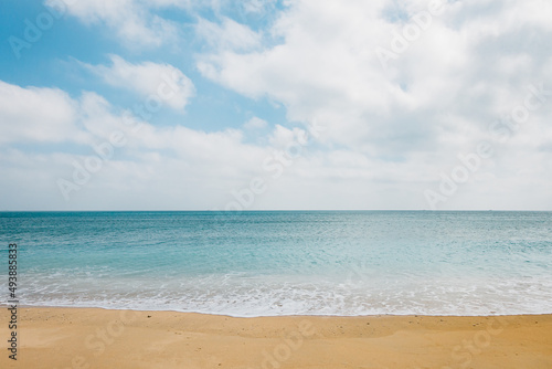 Deserted beach waves and sky © LI
