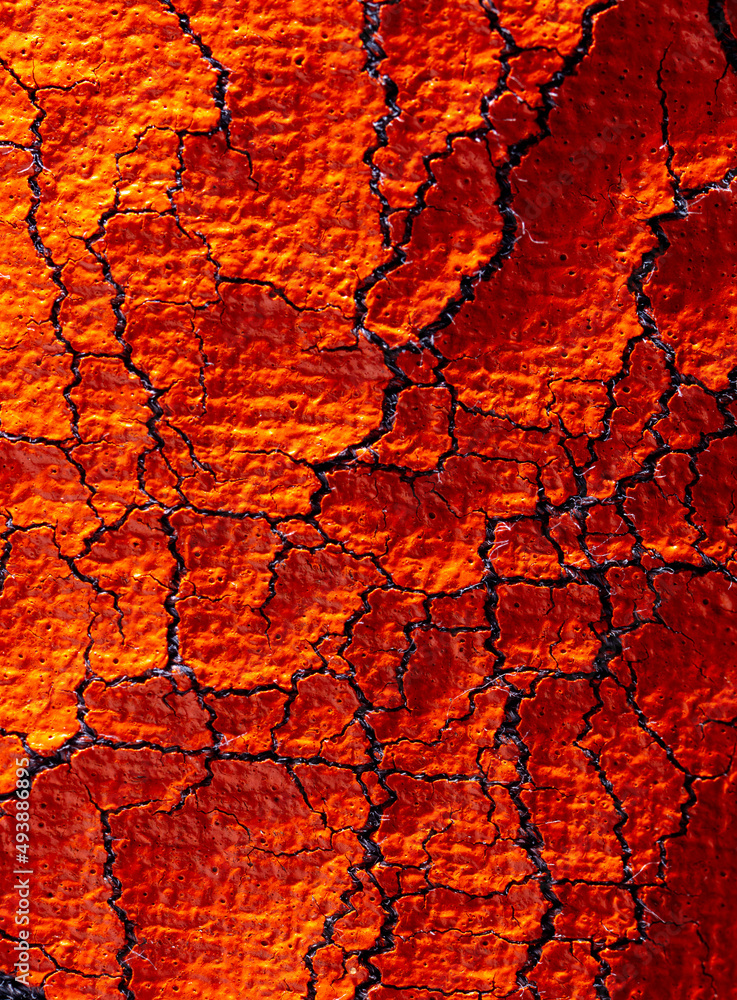 Cracked red paint on fabric as abstract background. Cracked red paint on fabric as abstract background.