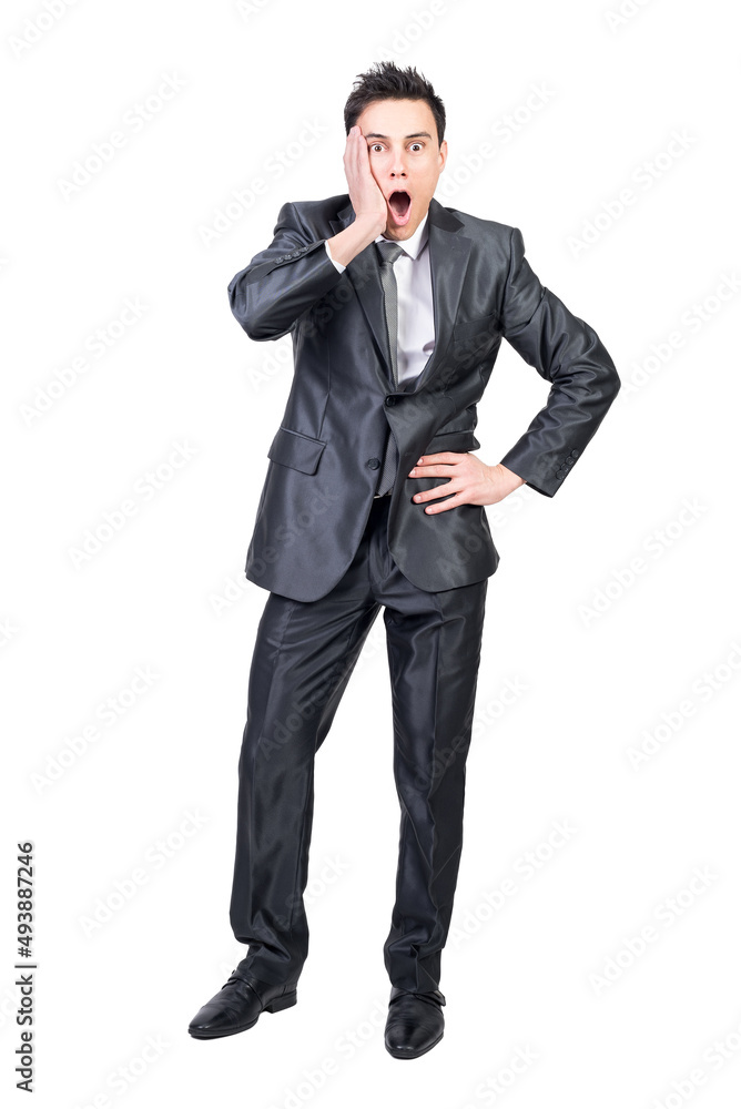 Shocked young businessman looking at camera with opened mouth Shocked young businessman looking at camera with opened mouth