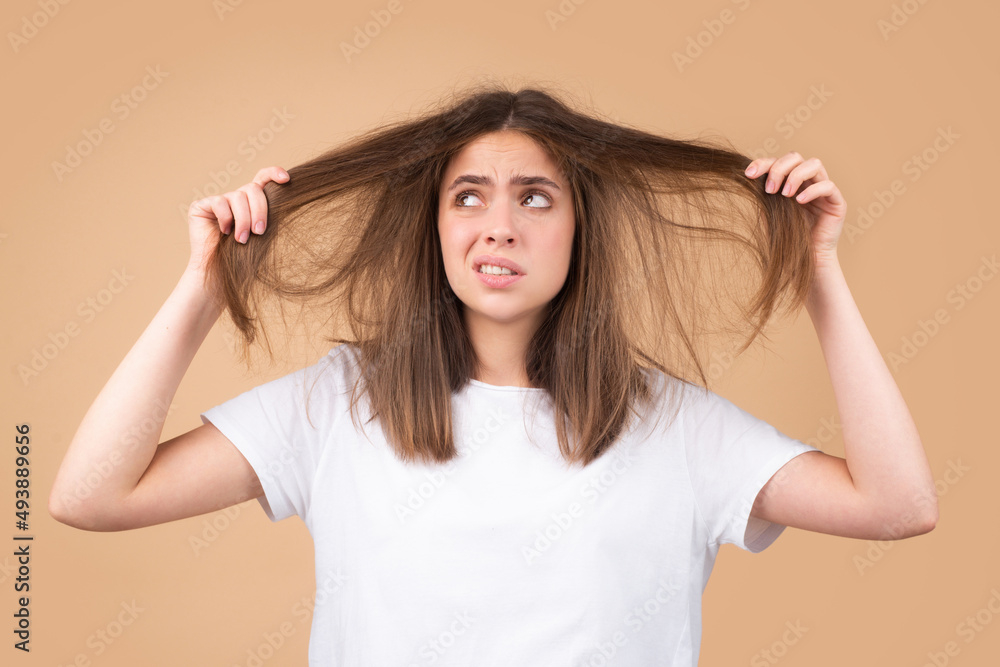 Woman hand holding comb with serious hair loss problem for health care shampoo. Woman hand holding comb with serious hair loss problem for health care shampoo.