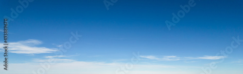 Panorama of blue sky with white foggy clouds