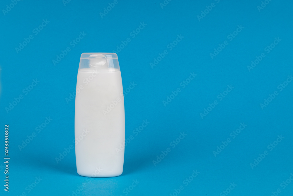 White container of cosmetics on yellow background. Skincare product set. Face and body care concept. White container of cosmetics on yellow background. Skincare product set. Face and body care concept.