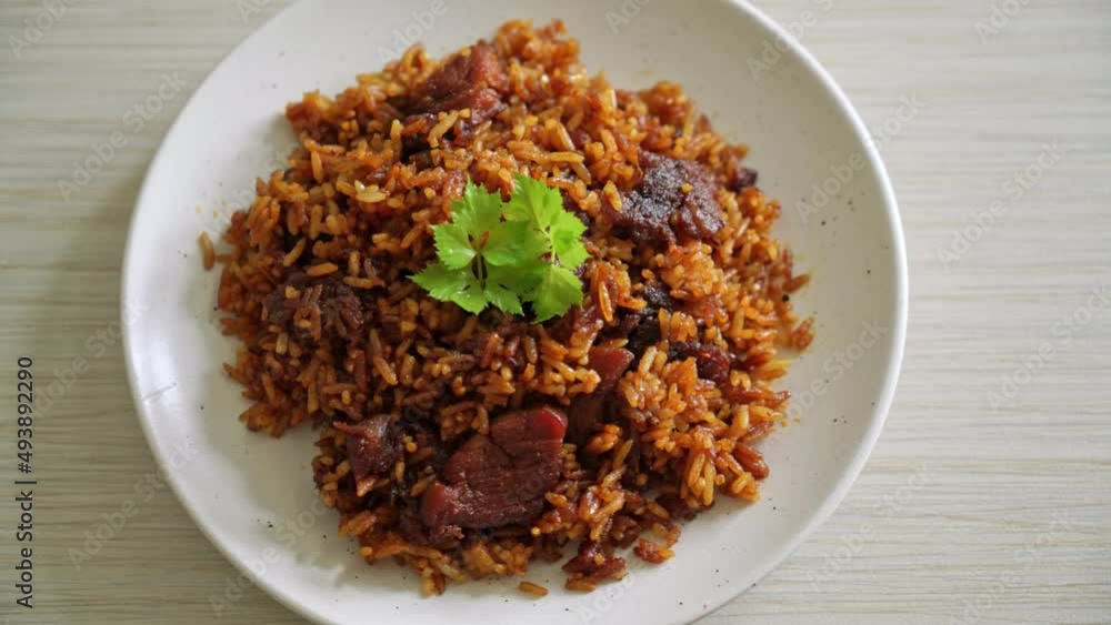 Nasi goreng - fried rice with pork in Indonesia style - Asian food style Nasi goreng - fried rice with pork in Indonesia style - Asian food style