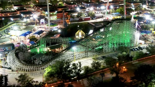 Aerial tilt up shot of illuminated roller coaster, Old Town Kissimmee photo