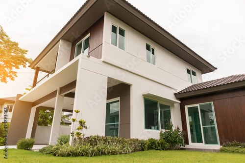 Beautiful modern house exterior with green grass