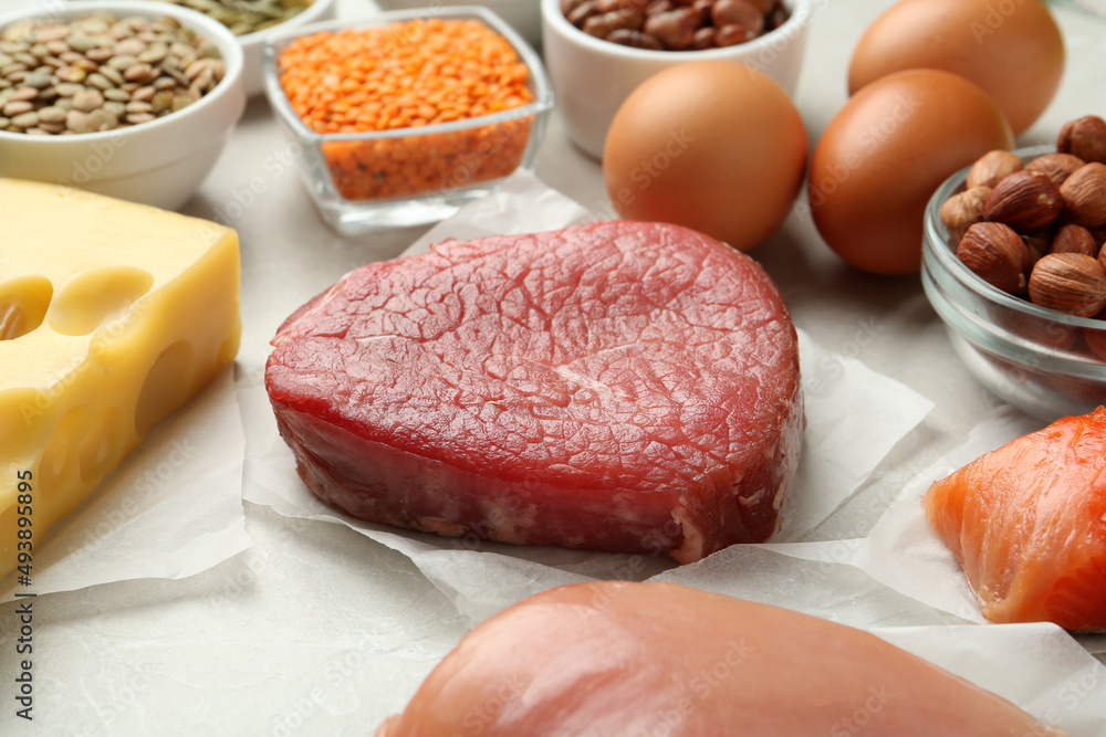 Set of products rich in amino acids on light grey table Set of products rich in amino acids on light grey table