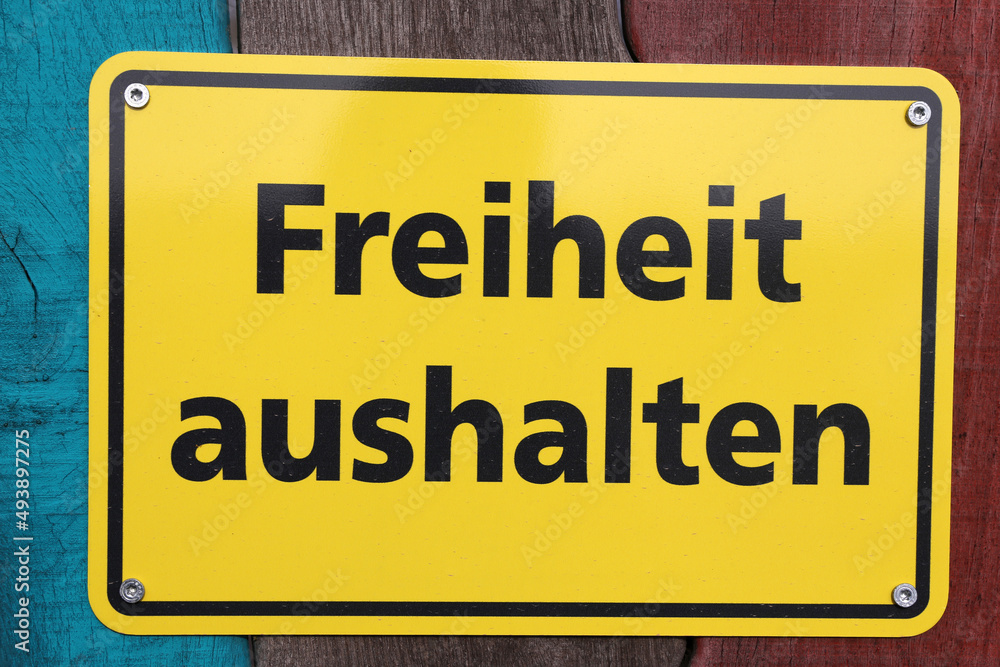 Schild mit der Aufschrift Freiheit aushalten Schild mit der Aufschrift Freiheit aushalten