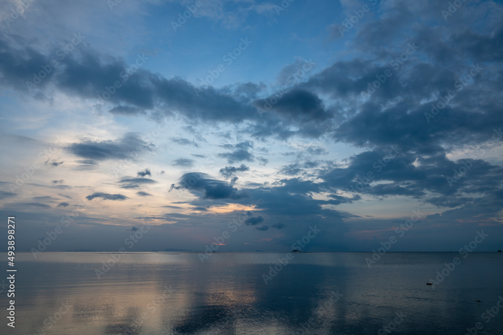 Beautiful sunset over the sea water on the island of Koh Phangan, Thailand. Travel and nature concept Beautiful sunset over the sea water on the island of Koh Phangan, Thailand. Travel and nature concept