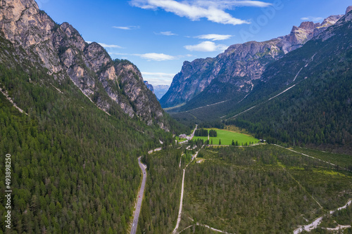 Aerial view of the green mountains forest in Dolomites, Italy