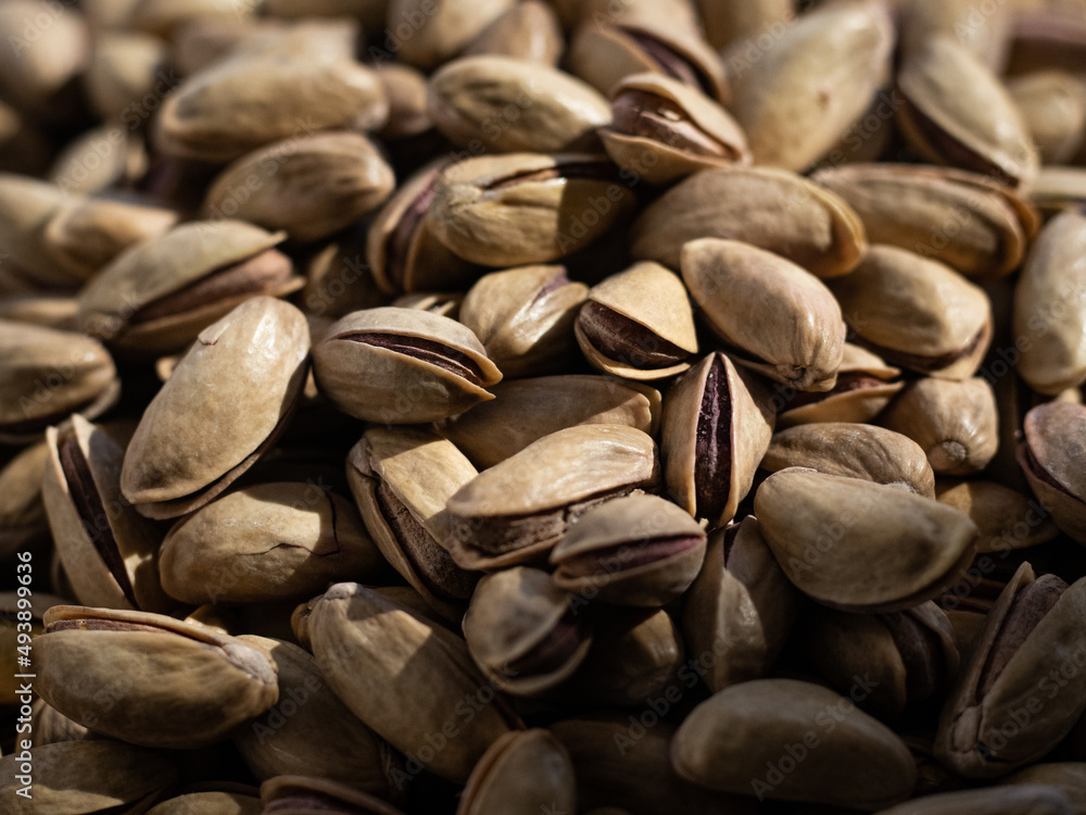 Pistachios texture and background . Tasty pistachios as background,as pistachios texture. flat lay Pistachios texture and background . Tasty pistachios as background,as pistachios texture. flat lay