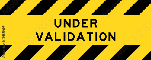 Yellow and black color with line striped label banner with word under validation