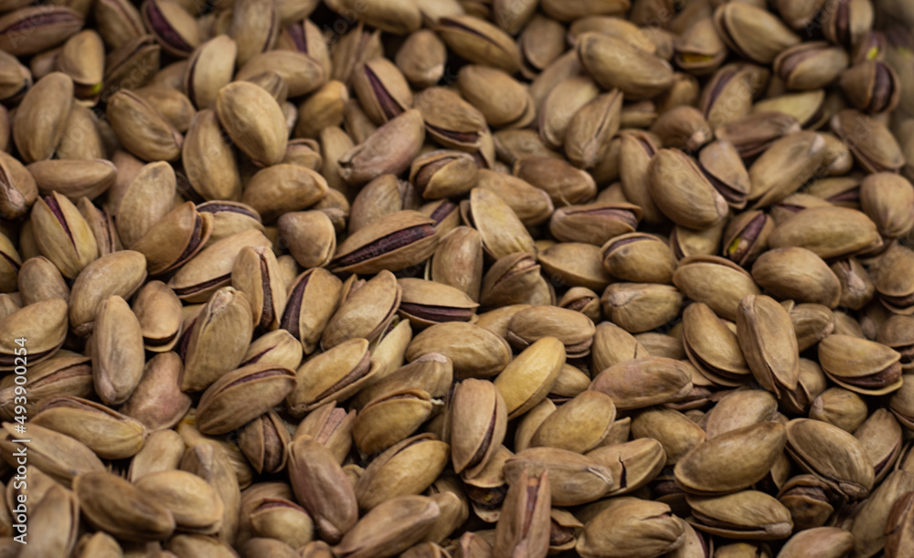 Pistachios texture and background . Tasty pistachios as background,as pistachios texture. flat lay Pistachios texture and background . Tasty pistachios as background,as pistachios texture. flat lay