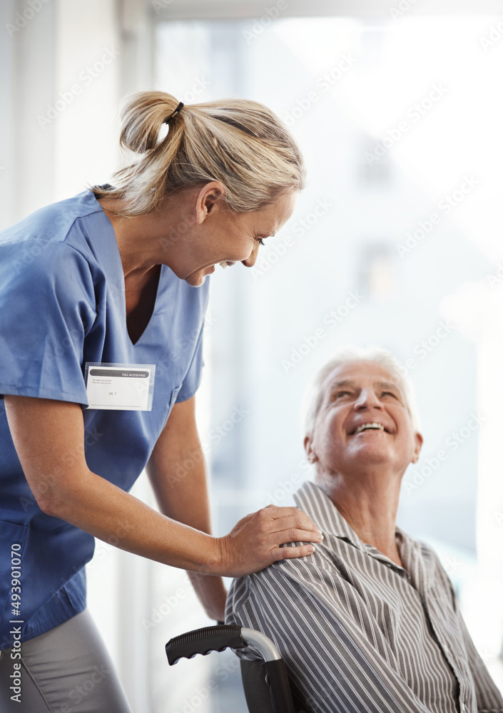 Where to, mister. Cropped shot of a mature female nurse and her senior male wheelchair-bound patient in the hospital. Where to, mister. Cropped shot of a mature female nurse and her senior male wheelchair-bound patient in the hospital.