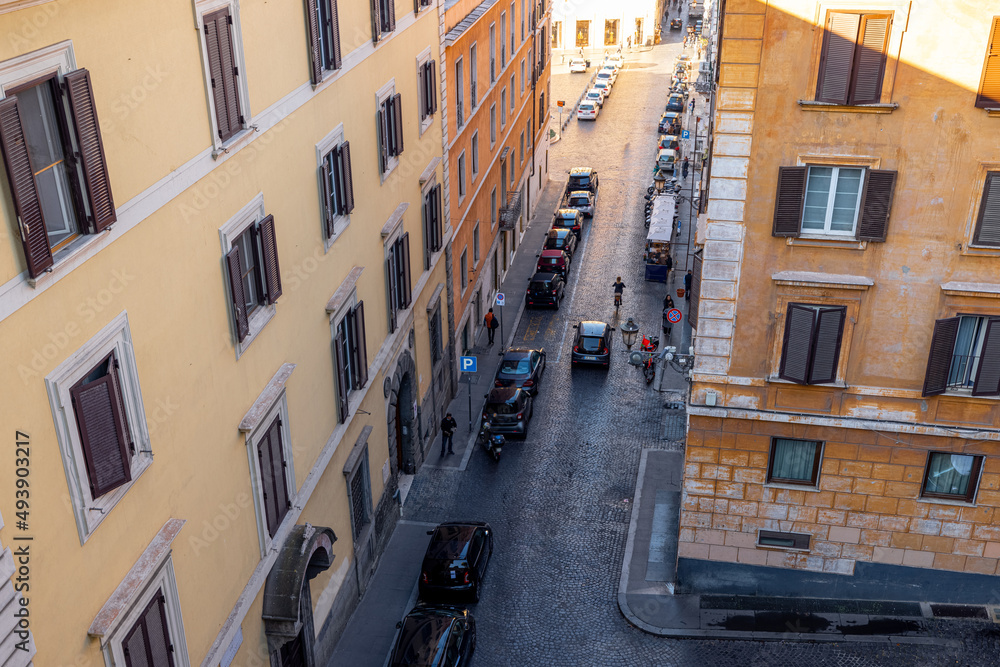 Top view of the city street in the old town of Rome. Traveling Italy. Italian architecture and buildings