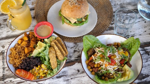A healthy breakfast with a variety of fresh vegetable dishes, freshly squeezed orange juice and an appetizing vegan burger awaits you on the restaurant table for an incredible stay in our restaurant.