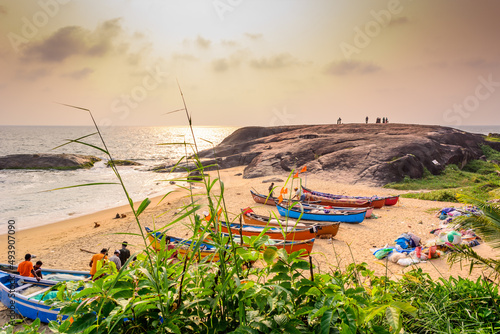 fishning boats at the rocky beach of Someshwar, Mangalore, Karnataka, India photo