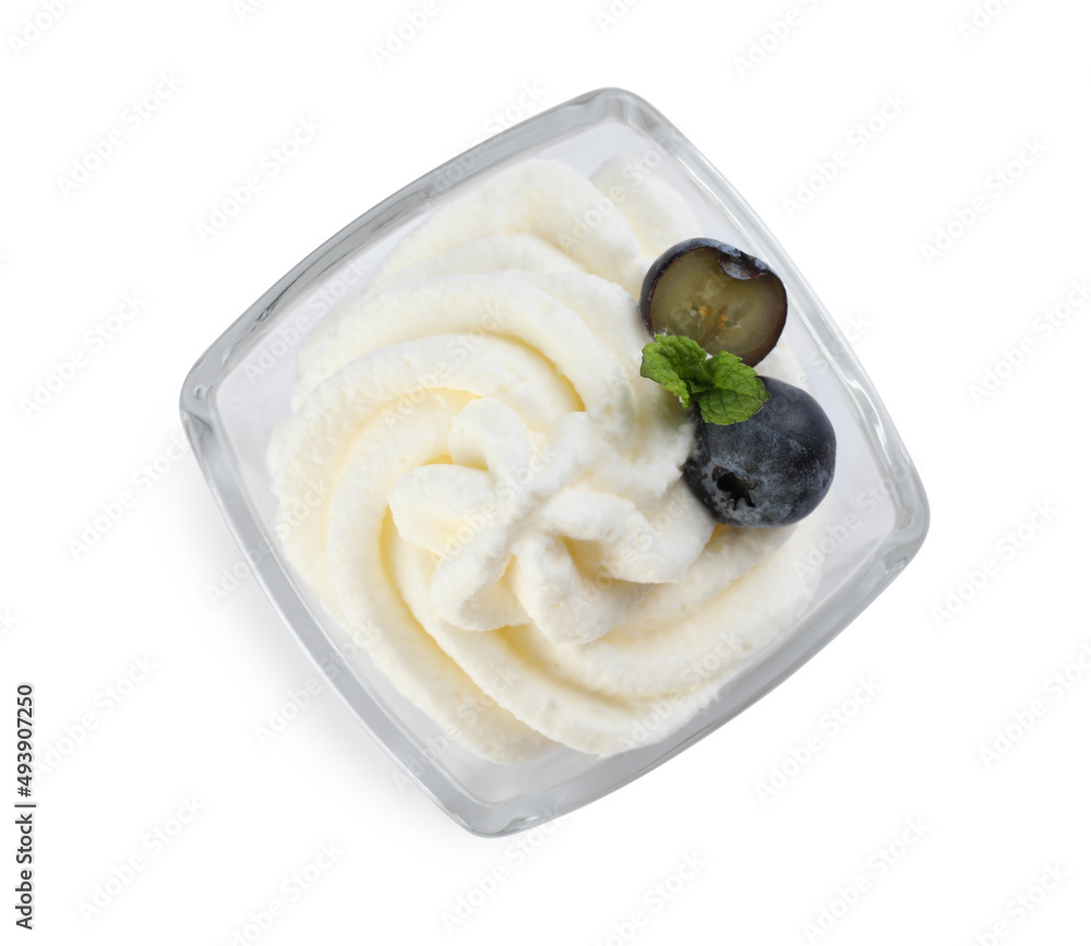 Delicious fresh whipped cream with blueberries and mint isolated on white, top view