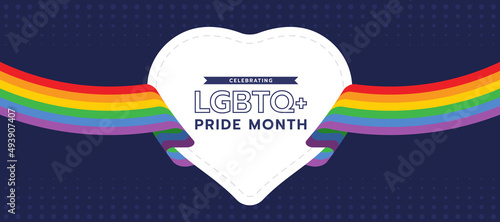 Celebrating LGBTQ+ pride month text in white heart and rainbow flag ribbon roll around on dark purple background vector design