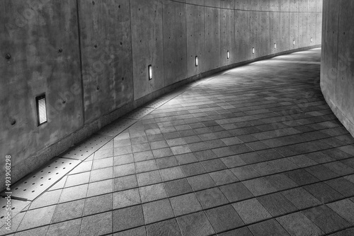 Empty pedestrian walkway in the dark
