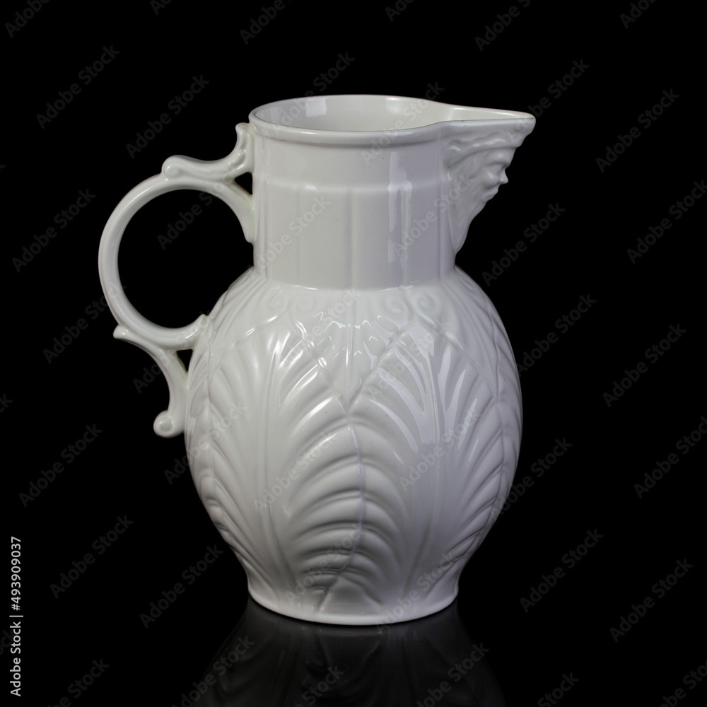 antique white porcelain vase in on a black isolated background. antique ceramic vase with stucco antique white porcelain vase in on a black isolated background. antique ceramic vase with stucco
