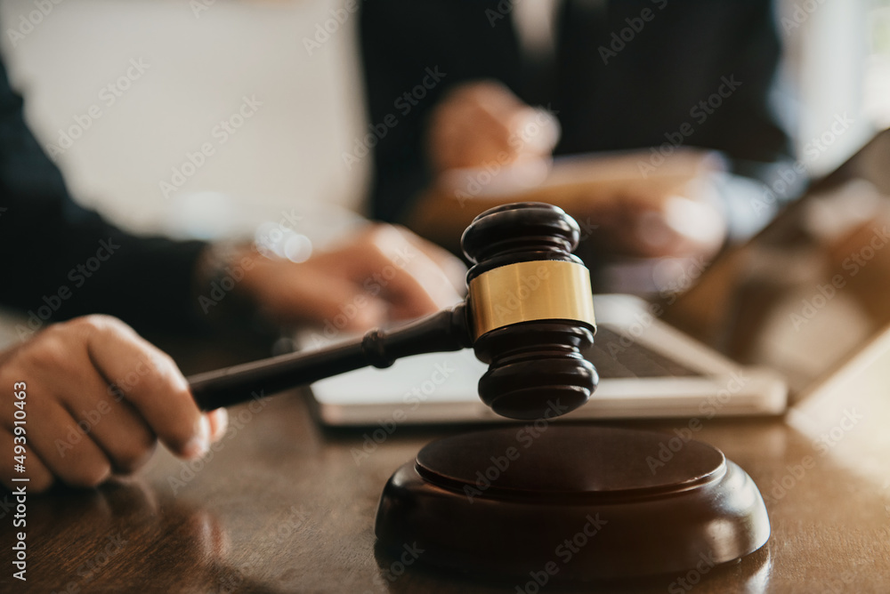 Φωτογραφία Business people and lawyers discussing contract papers sitting in the table at office in the morning