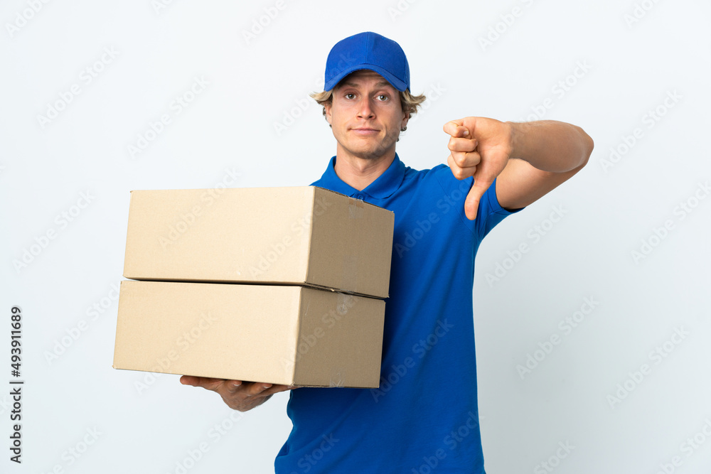 Delivery man over isolated white background showing thumb down with negative expression Delivery man over isolated white background showing thumb down with negative expression