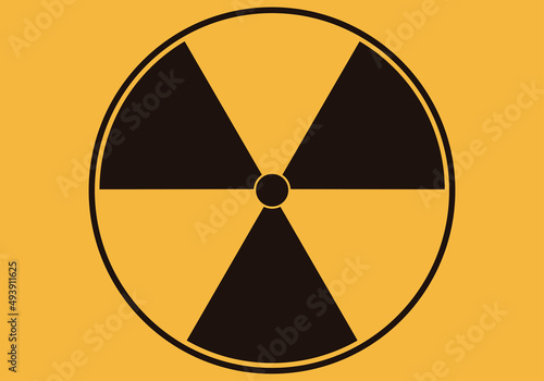 Icono de radiación en fondo amarillo.