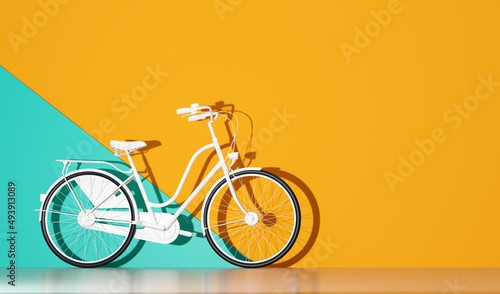 White bicycle on colorful wall background. photo