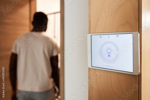 Smart home lighting system on tablet PC mounted on wall