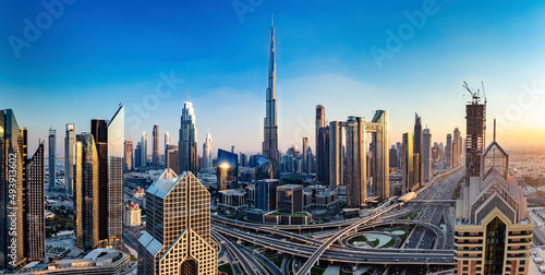 Fotobehang Burj Khalifa in Dubai downtown skyscrapers highrise architecture at sunset