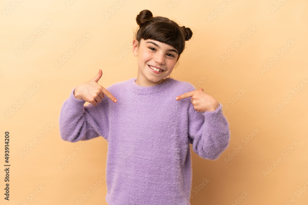 Little caucasian girl isolated on beige background proud and self-satisfied Little caucasian girl isolated on beige background proud and self-satisfied