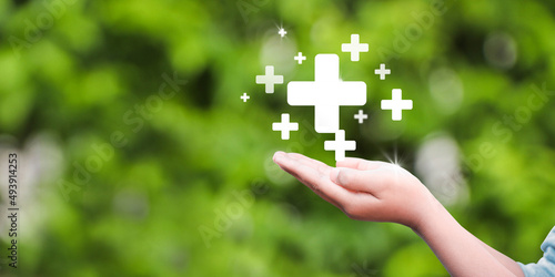 hand holding plus icon. Plus sign virtual means to offer positive thing (like benefits, personal development, social network)Profit,health insurance, growth concepts.