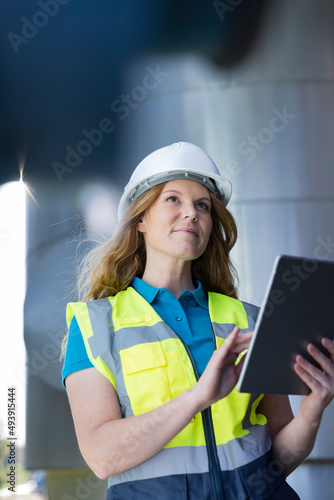 Wallpaper Mural Technician wearing protective workwear using tablet PC in industry Torontodigital.ca