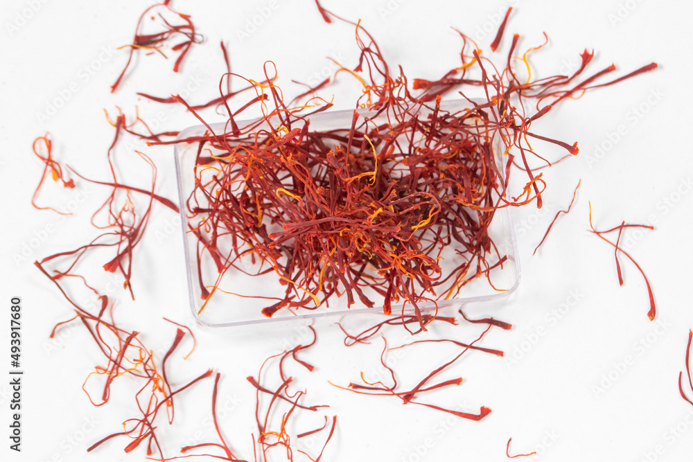 Naklejka premium Saffron on white background, kesar, crocus, saffron background, pile of saffron
