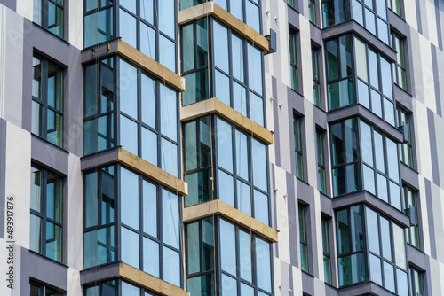 construction of a modern high-rise building, concrete walls and metal frame for glass