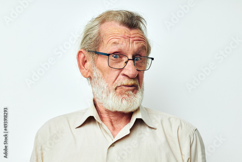 Senior grey-haired man wears glasses in shirts cropped view
