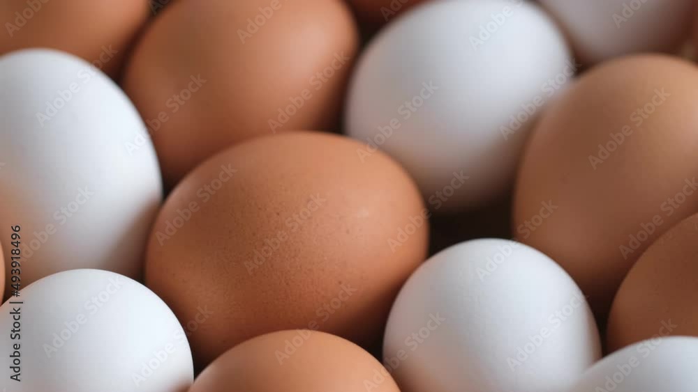 Chicken egg, rotation shot, Chicken fresh raw eggs.Healthy fresh food ingredients for breakfast. Animal products. Grocery. Chicken farm fresh eggs Chicken egg, rotation shot, Chicken fresh raw eggs.Healthy fresh food ingredients for breakfast. Animal products. Grocery. Chicken farm fresh eggs