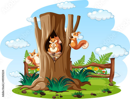 Three squirrels eating nuts in hollow