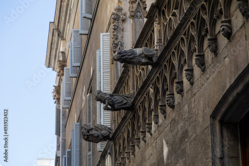 Statues on a wall 