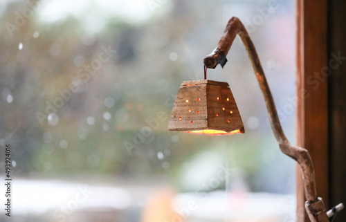 Looking out the snowy window with a cute lamp