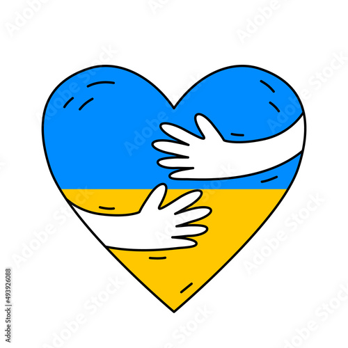 hands hug a heart painted in the colors of the Ukrainian flag. love for one's country and freedom.