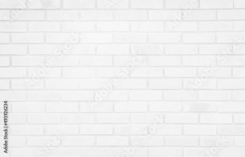 White grunge brick wall texture background for stone tile block painted in grey light color wallpaper modern room backdrop design.