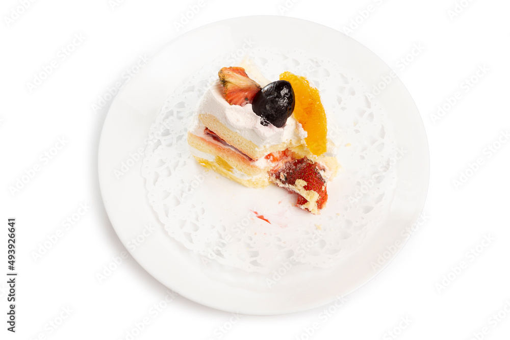 bitten cake on the white plate isolated on white background. Clipping path bitten cake on the white plate isolated on white background. Clipping path