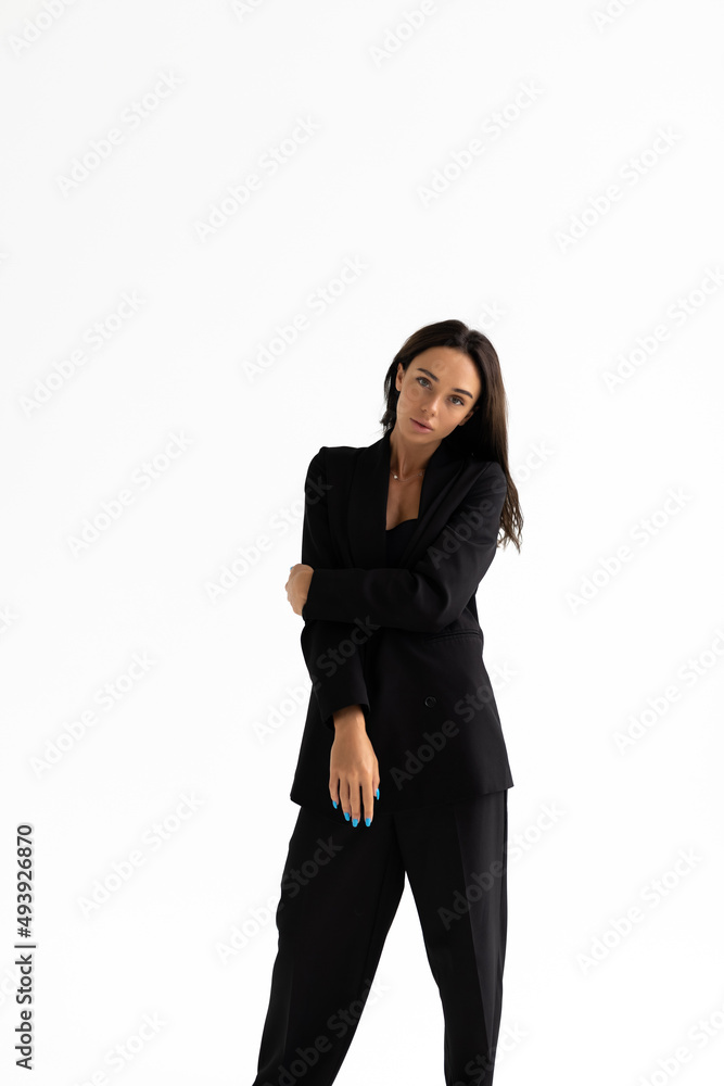 Sexy slim woman wearing black bra fashionable with holding suit isolated on white background.