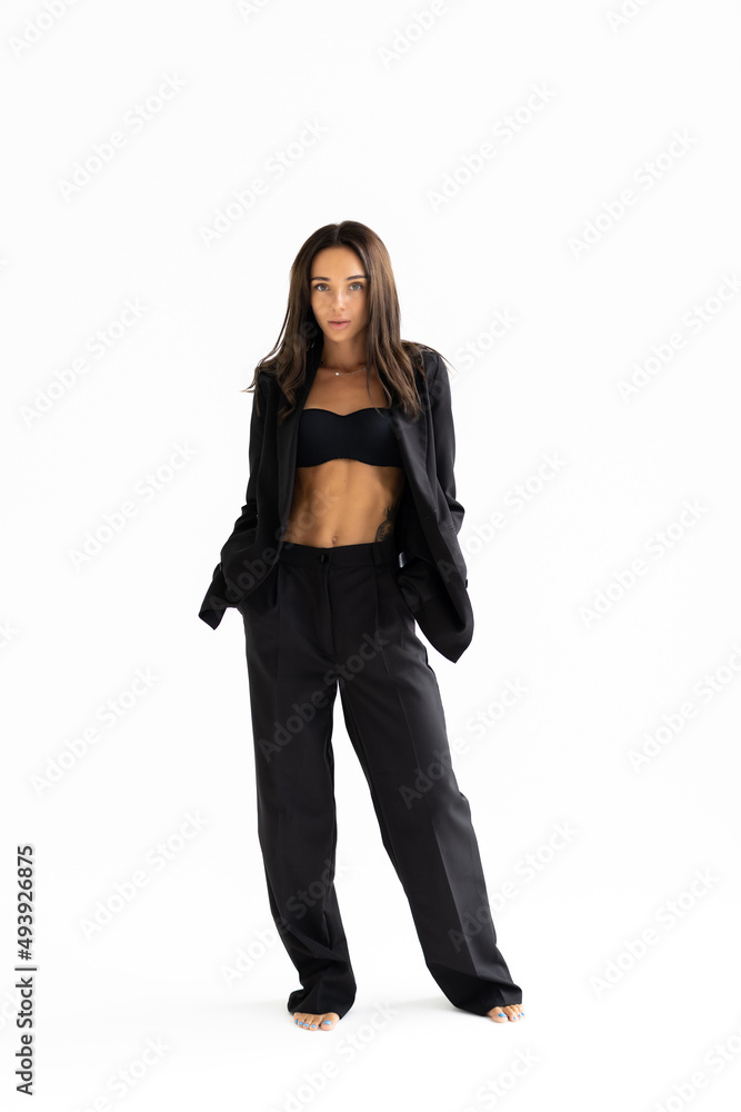 Full length portrait of smiling attractive businesswoman in suit isolated over white background Full length portrait of smiling attractive businesswoman in suit isolated over white background