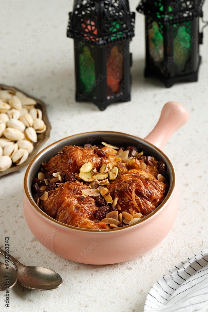 Fototapeta premium Umm Ali Um Ali, Also Called Om Ali, Egyptian Version of Bread Pudding with Pistachios and Nuts
