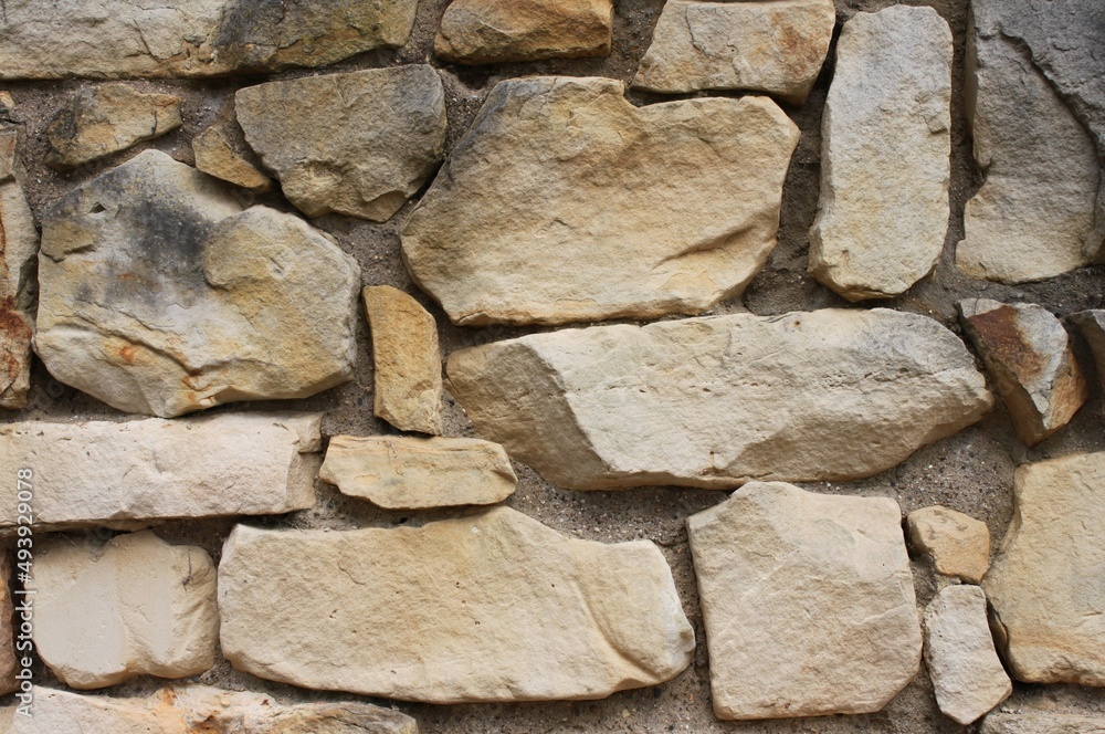 Fototapeta premium a sand-lime brick wall made of bricks with irregular surface