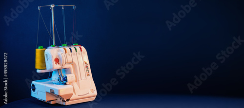 overlock sewing machine with multicolored thread photo